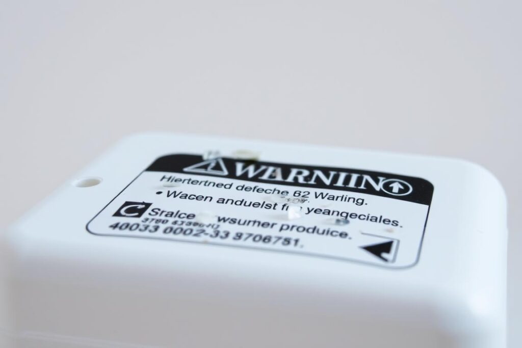 Defective product with warning label representing product liability cases Defective product with warning label representing product liability cases